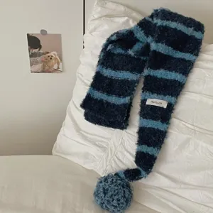 Cozy striped fuzzy knit scarf for winter warm plush fashion with cute pom pom design.