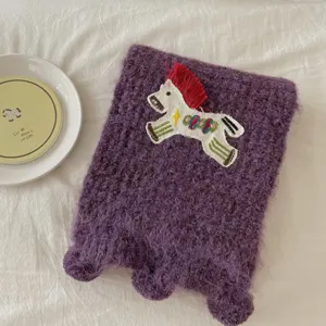 Cozy purple knitted scarf featuring a cute embroidered pony patch. Perfect winter warm accessory.