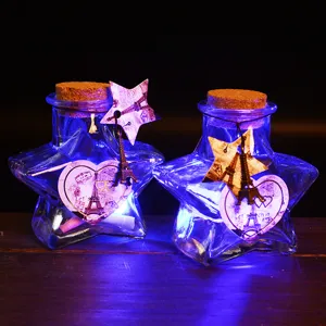 Star glass wishing bottle with LED lights, cork, and Eiffel Tower decor for romantic gifts.