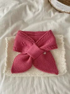 Cozy pink knit short scarf detail, soft cable jacquard texture with cute metal heart charm.