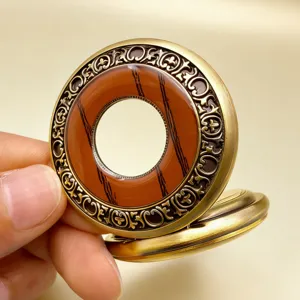 Vintage mechanical pocket watch detail shot, antique bronze carved bezel, wood grain accent.
