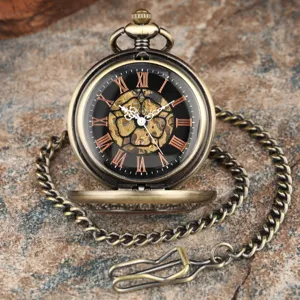 Vintage bronze mechanical pocket watch with hollow roman numerals dial and antique chain.