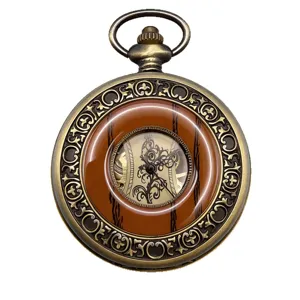 Vintage antique bronze mechanical pocket watch with wood pattern and ornate hollow dial design.