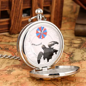 Vintage silver pocket watch with music movement and classic umbrella logo design detail.