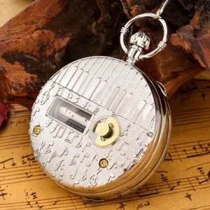 Retro silver music box pocket watch featuring piano keys relief and vintage sheet music design.