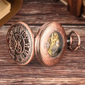 Detailed view of vintage bronze pocket watch with hollow gear design and roman numerals.