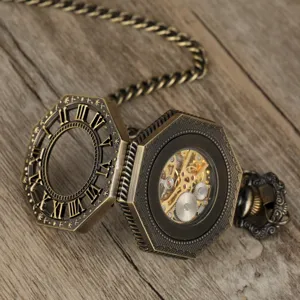 Close-up of vintage bronze mechanical pocket watch showing skeleton gears and roman numerals.