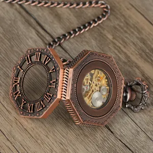 Detailed view of vintage bronze mechanical pocket watch with hollow Roman numerals.