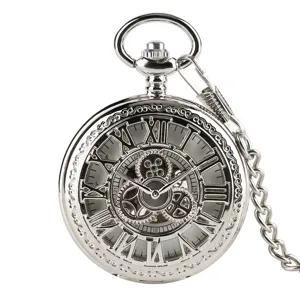 Vintage silver mechanical pocket watch with hollow gear design and Roman numerals.