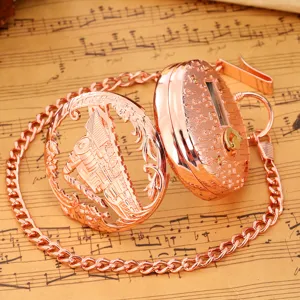 Retro rose gold mechanical pocket watch with hollow steam locomotive design and music box chain.