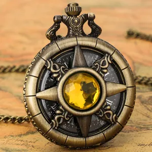 Vintage bronze pocket watch with hollow compass star design and yellow crystal stone dial accessory.