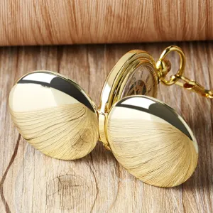 Vintage gold mechanical pocket watch with double open covers and hollow dial design.