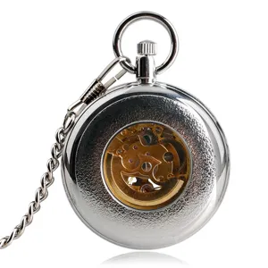 Detailed view of the vintage silver mechanical pocket watch featuring a hollow gear movement.