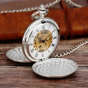 Vintage silver mechanical pocket watch with skeleton dial Roman numerals and chain detail