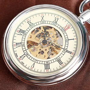 Detailed view of vintage skeleton mechanical pocket watch with silver case and Roman numerals.