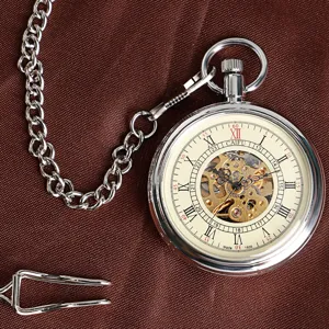 Silver mechanical pocket watch with chain, skeleton dial and classic Roman numerals detail.