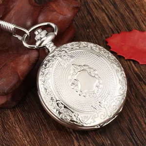 Vintage silver quartz pocket watch with classical carved shield cover and matching chain.