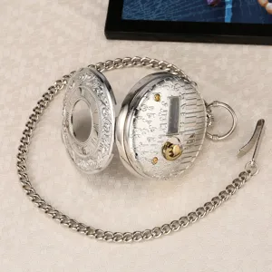 Silver tone quartz pocket watch with long chain and music box design for vintage lovers.