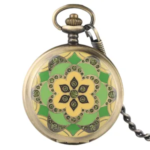 Vintage bronze manual mechanical pocket watch with green enamel floral pattern and elegant chain.