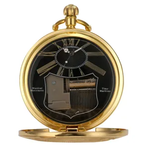 Vintage gold quartz pocket watch with visible mechanical music box movement and roman numerals.