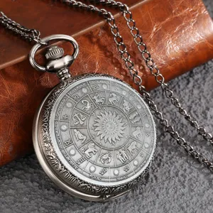 Vintage quartz pocket watch with zodiac constellation dial and long chain necklace.