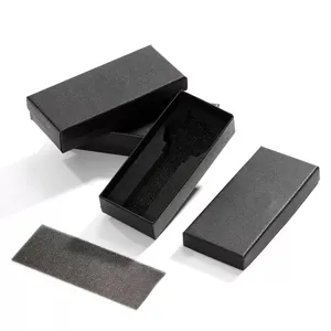 Black rectangular watch gift box detail, premium cardboard storage case with foam insert.