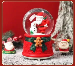 Christmas snow globe music box with Santa and snowman, festive desktop decoration gift.