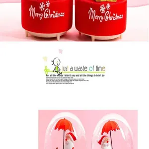 Detailed view of Christmas music boxes, showing Santa and festive designs clearly.