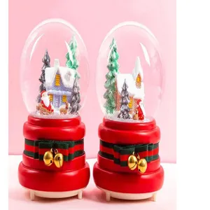 Christmas Santa snow globe music box with glowing light and festive winter wonderland scene.