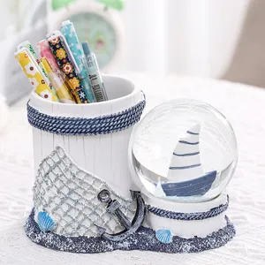 Mediterranean style sailboat snow globe pen holder, creative resin desktop organizer storage.