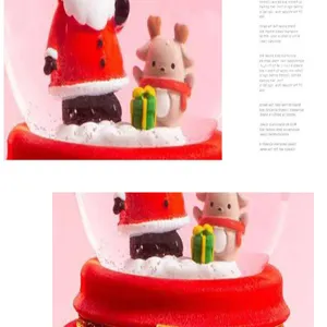 Christmas snow globe music box featuring Santa Claus and cute deer, glowing holiday decor detail.
