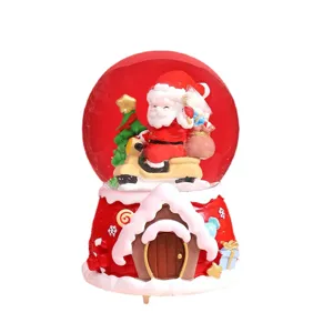 Christmas Santa Claus snow globe music box with glowing lights and festive holiday decor