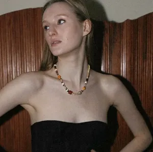 Designer natural stone and wooden bead asymmetrical colorful gemstone necklace detail shot