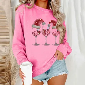 Pink Christmas sweatshirt featuring cute wine glass graphic print, long sleeves and casual fit.