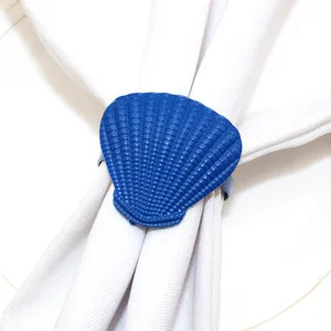 Blue seashell napkin ring detail shot, perfect for summer ocean themed table decor settings.