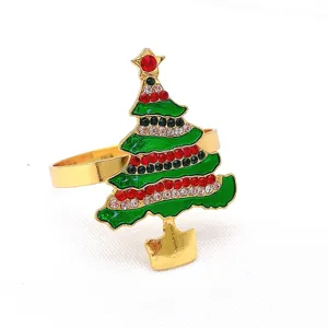 Christmas tree napkin ring detail featuring gold metal and sparkling rhinestones for table decor.