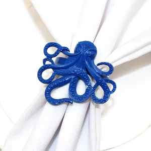 Detailed view of the blue octopus napkin ring featuring intricate textured metal tentacles.