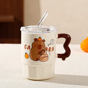 Close-up detail of the cute capybara ceramic mug, featuring glass straw and creative handle.