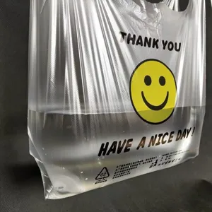 Transparent plastic shopping vest bag with cute smiley face and thank you print for daily use.