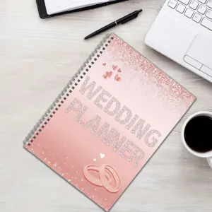 Wedding planner spiral notebook with pink glitter cover, elegant diamond design for bride.