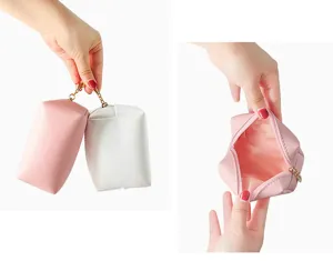 Portable PU leather cosmetic bag with secure zipper, ideal for travel and daily storage use.