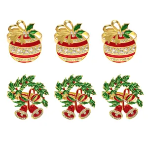 Detail shot of Christmas napkin rings, featuring colorful balls and bells with rhinestones.