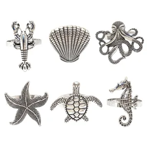 Détails ensemble ronds de serviette marins, métal argenté vintage homard coquillage pieuvre.