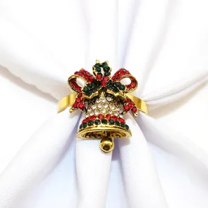 Christmas bell napkin ring detail, sparkling rhinestone table decor accessory for holiday party.