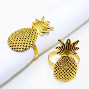 Gold pineapple metal napkin ring for dining table, elegant kitchen table decor and accessory.