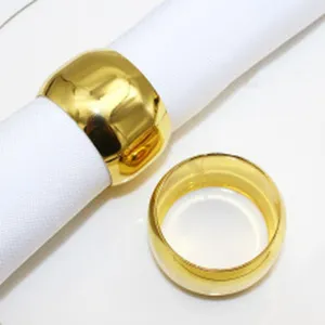 Gold metal napkin ring close up detail view, elegant table decor loop for restaurant.