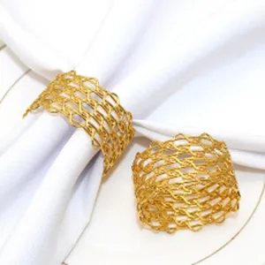 Gold metal napkin ring detail shot, showing the delicate interwoven mesh texture design clearly.