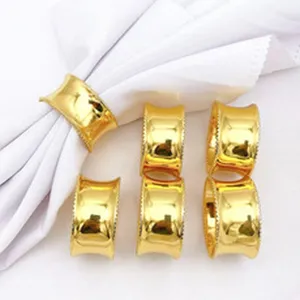Gold metal napkin rings set, elegant curved table decor ring for restaurant party dining table.
