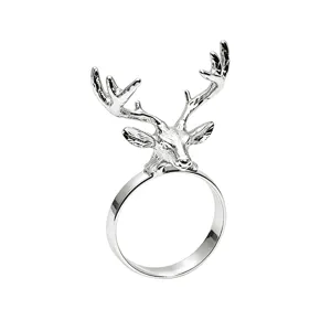 Silver metal reindeer napkin ring for Christmas dinner table decor and elegant table setting.