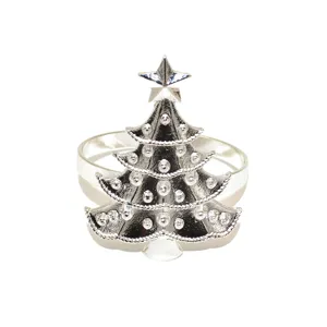 Silver Christmas tree napkin ring detail shot, elegant metal holiday table decor.
